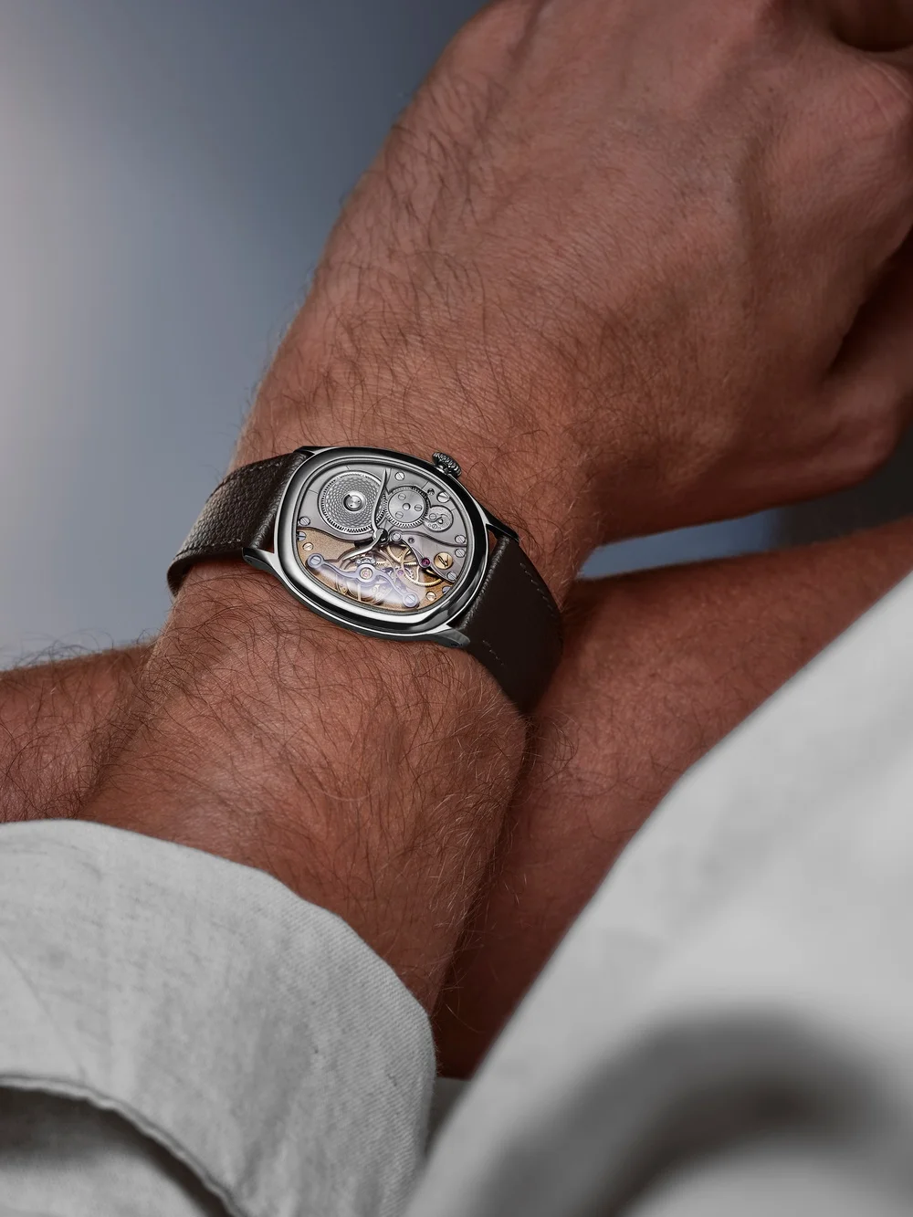 The white-gold Miroir shown on leather; the bracelet configuration is priced in this roundup.